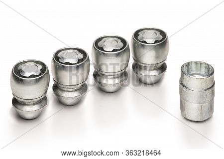 Car Lock Nuts, Wheel Nut That Protect The Wheels From Theft. Close-up Of The Isolate On A White Back