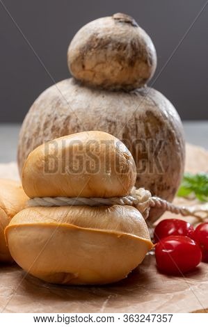 Italian Semi Hard Handmade Smoked Scamorza And Caciocavallo Matured In Caves Cheeses Made From Cow M