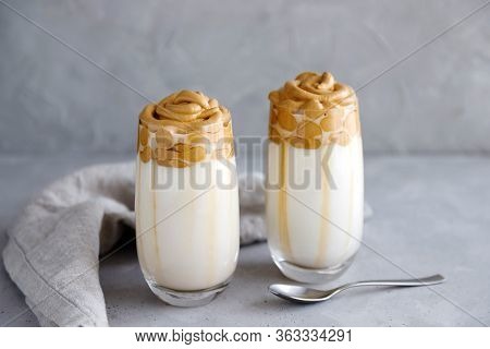 Two Glasses With A Chilled Dalgon Drink On A Gray Background With Beautiful Smudges From Coffee Foam