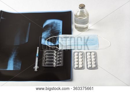 X-ray Film Thoracic Spine With Medical Face Mask. Concept Of Medical Service, Diagnosis And Treatmen