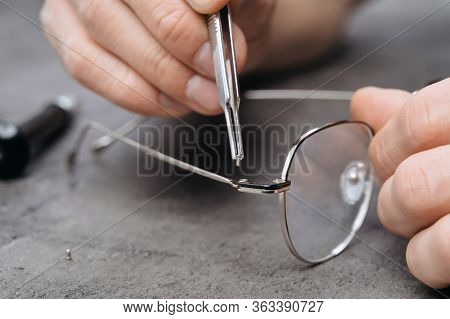 Fixing Of Eyeglasses Frame In Optician Office