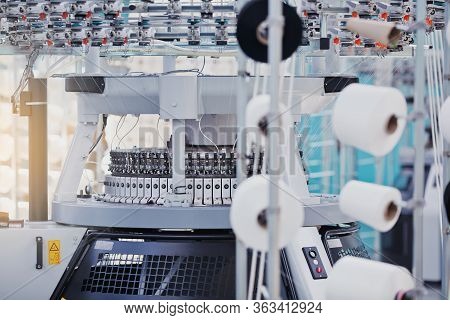 Textile Manufacturing. Circular Knitted Fabric. Textile Factory In Spinning Production Line And A Ro