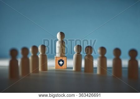 Wooden Figures On Cube With Medical Sign. Insurance Broker And Clients. Insurance Service, Copy Spac