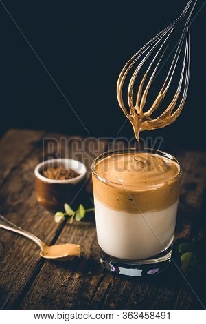 Dalgona Coffee, A Cool Fluffy Whipped Coffee In A Glass. Latte Espresso With Coffee Foam In Tall Gla