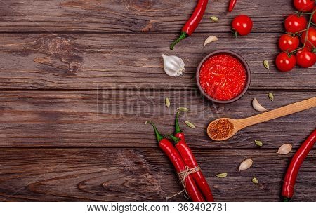 Ajvar Or Pindjur Red Vegetable Spread Or Pepper Paprika And Tomato Mousse In A Clay Bowl And Ingredi