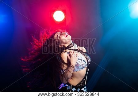 Girl Dancing Belly Dance, Fusion Or Tribal. A Woman In A Beautiful Costume Demonstrates Charming And