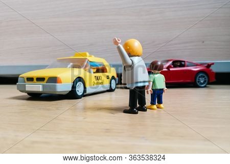 Madrid, Spain - July 13, 2019: Playmobil Figurines In Scene Representing Man With Child Stopping A T