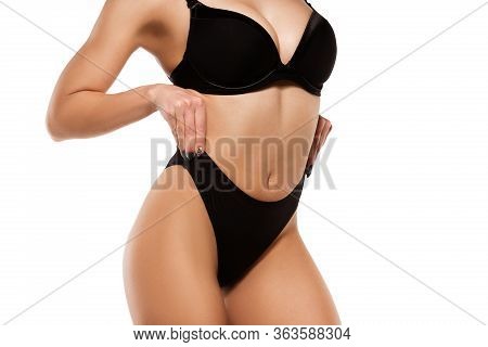 Beautiful Female Legs, Buttlocks And Belly Isolated On White Background. Beauty, Cosmetics, Spa, Dep