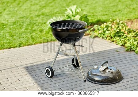 bbq and grilling concept - grill brazier outdoors
