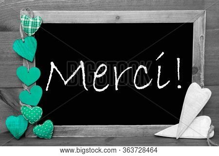 Balckboard With Turqouise Heart Decoration, Text Merci Means Thank You