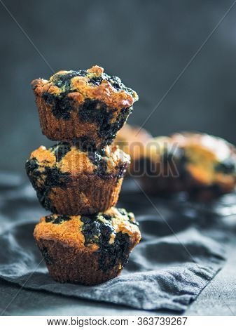Homemade Vegan Blueberry Muffins On Dark Background. Stack Of Three Egg-free Muffins With Copy Space