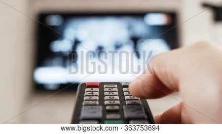 Male Hand Holding Remote The Control Turn Off Smart Tv. Close Up.