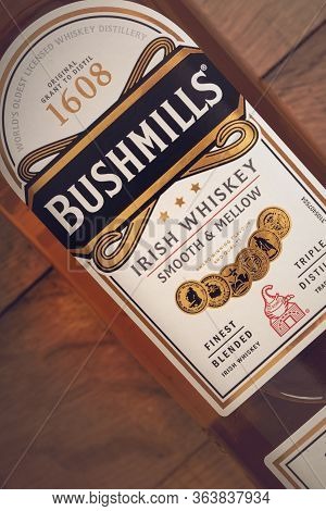 Varna, Bulgaria - March 16, 2020: Bushmills Whiskey Bottle On Wooden Background, Close Up. Bushmills