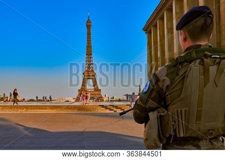 Paris , France - April 24 , 2020 : Paris military soldier conter terrosrism operation watching trocadero square during lock down coronavirus covid-19 quarantine