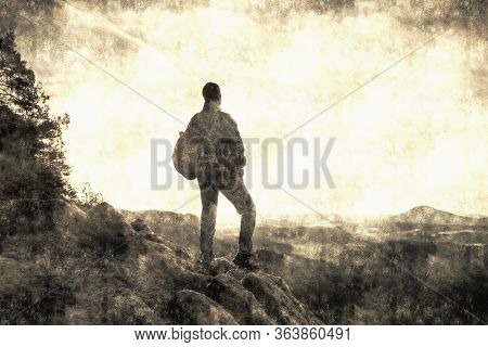 Hiker Tourist Traveler On A Mountain Top In Summer, With His Back With Backpack Calotype Filter. Old