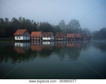 Boat Houses At Grosser Alpsee In The Allgaeu In Bavaria