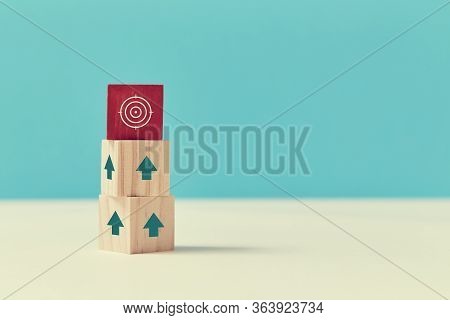 Goal Achievement. Career Growth And Development. Reach Goal. Wooden Cubes With Red Block On Top, Up 