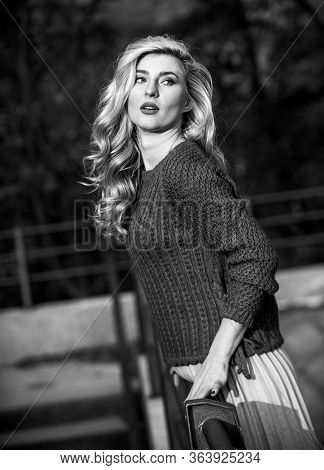 Trendy Beauty. Autumn Woman Curly Hair Outdoor. Girl Long Blond Hair City Walk. Girl In Corrugated S