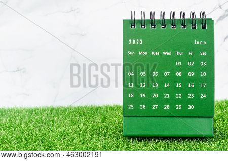 Green June 2023 Monthly Desk Calendar For 2023 Year On Grass.