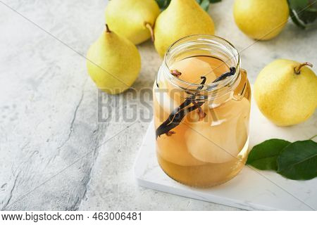 Canned Pear Compote With Vanillin. Pear Compote. Homemade Delicious Canned Pear Compote In Glass Jar