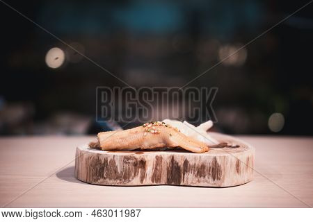 Fresh Anago Sushi On A Wood Plate. Close Up
