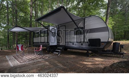 Camper Trailer Set Up With Awnings Out At A Campsite At Jordan Lake