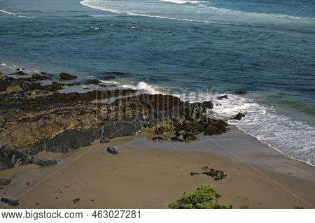 Looking Down At Empty Beach In The Atlantic Ocean, Along Marginal Way In Ogunquit Maine, Showing Wav