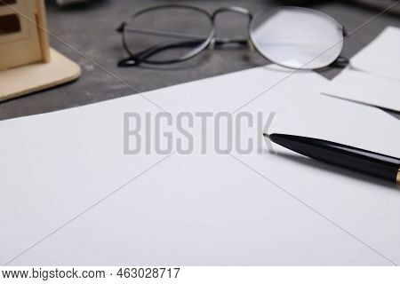 Last Will And Testament With Pen Near Glasses On Grey Table, Closeup
