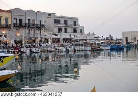 Rethymnon, Crete, Greece - Sept 18, 2021: Waterside Restaurants In Early Evening Light At Old Veneti