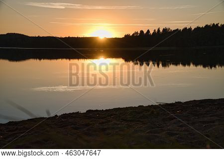 Sunset With Reflection On A Swedish Lake In Smalland. Romantic Evening Mood. Landscape Shot From Sca