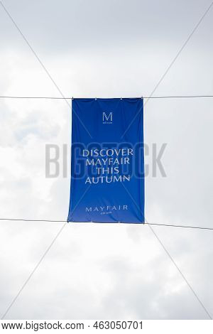 London, Uk - September 1, 2022: Low Angle View Against Sky Of Discover Mayfair Banner On Duke Street