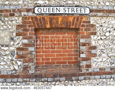 Street Name Queen Street On Wall Of Stone And Brick, Close-up