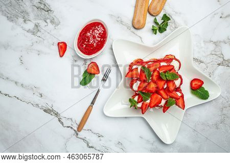 Homemade Tiramisu Cake With Fresh Strawberry, Mascarpone And Mint. Tiramisu Portion On Plate On Ligh