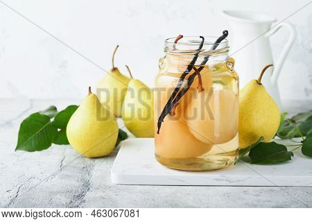 Canned Pear Compote With Vanillin. Pear Compote. Homemade Delicious Canned Pear Compote In Glass Jar