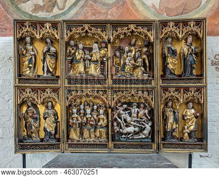 Germany, Lubeck - July 13, 2022: Heiligen Geist Hospital. Closeup Of 8-sculpture Setups Reredos With