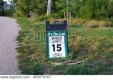 Bicycle Speed Limit Sign In Grass On Side Of Hiking Trail In Residential Area Outdoors Landscape Pho