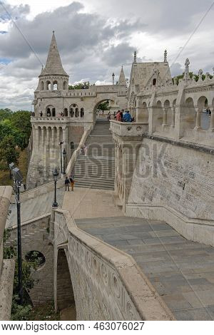 Budapest, Hungary - July 31, 2022: Tourists Visiting Fisherman Bastion Halaszbastya Monuments Locate
