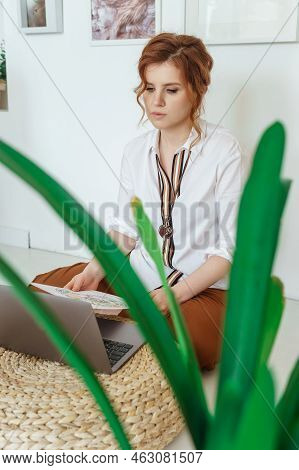 Tver, Russia-july 31, 2022 A Woman With A Laptop Is Studying Human Design. The Concept Of Studying E