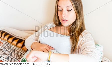 Pregnant Time Go Hospital. Pregnant Holding Baby Belly, Woman Watching Clock. Childbirth Time, Contr