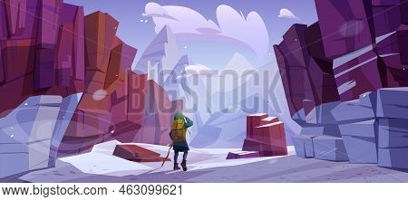 Traveler At Winter Mountains, Travel Journey, Adventure. Tourist With Backpack And Wood Staff Stand 