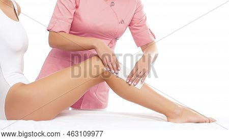 Hair Removal, Beauty And Health Concept. A Young Girl Is Getting An Epilation Procedure. A Processio