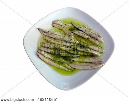 Marinated Anchovies In Vinegar With Olive Oil And Parsley. Traditional Spanish Tapa. Isolated On Whi