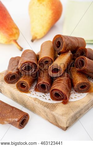 Pile Of Pear Pastila Rolls For Tea. Healthy Sweet School Snack For Kids. Fruit Leather On Wooden Boa