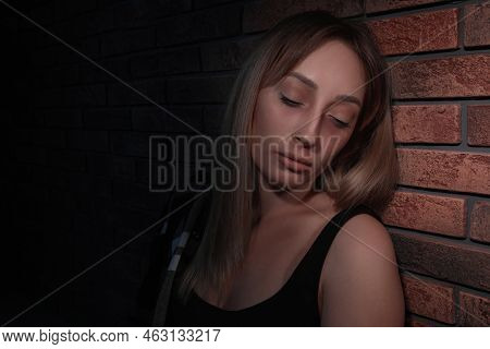 Overdosed Drug Addicted Woman Near Brick Wall