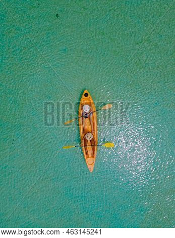 Men And Women In Kayak In The Ocean Of The Tropical Island Of Koh Mak Thailand