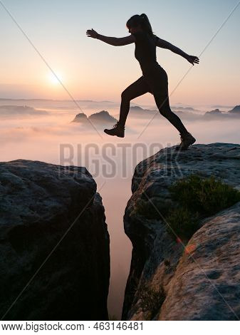 Kleiner Winterberg, Germany. June 27 2021. Fearless Sport Body Woman Jump Over Gulch Between Rocky E