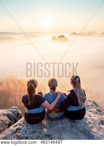 Kleiner Winterberg, Germany. June 27 2021. Three Girls Hug Each Other. Girl Friends Sitting Together
