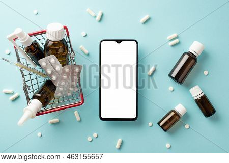 Healthcare Concept. Top View Photo Of Smartphone Shopping Cart With Medicines Spray Syrup Bottles Pi