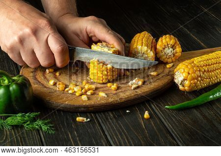 The Chef Cuts Corn Kernels With A Knife. Maize Is An Excellent Dietary Breakfast Or Lunch By The Coo
