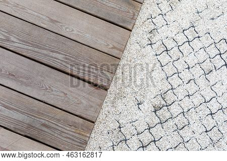 Wooden Walkway And Pedestrian Path Made Of Fine Gravel Reinforced With Geogrid In A Public Park. Arc